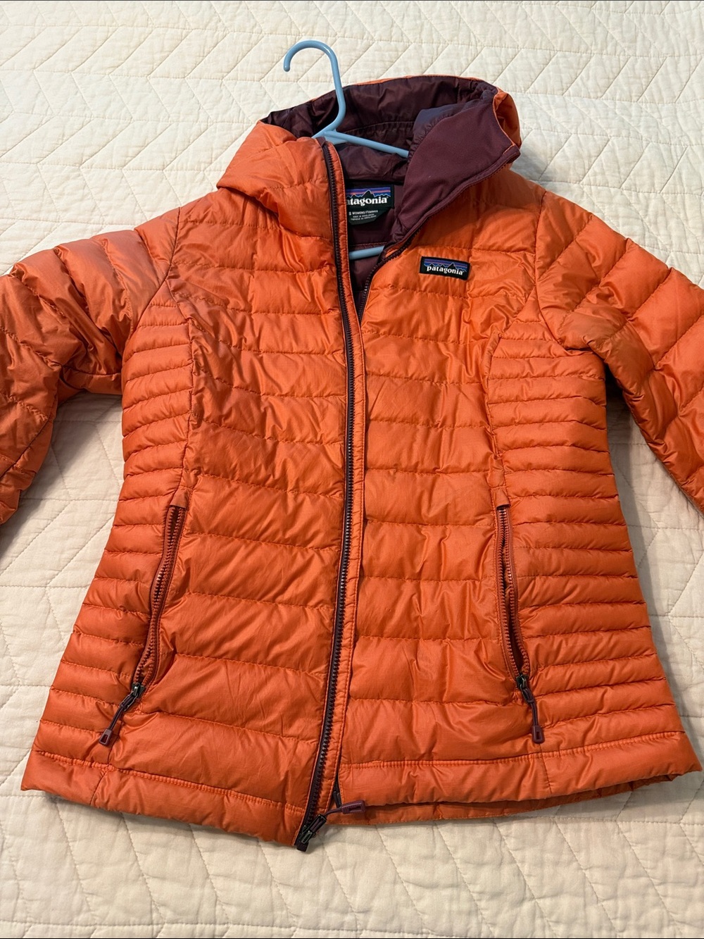 Patagonia Women’s Orange Puffer Jacket with Maroon Lining